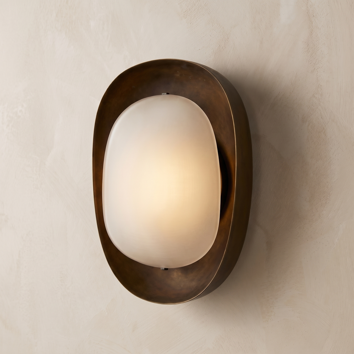 AX924 bronze wall sconce glowing warm white – organic oval wall lamp for living room, hallway and bedside