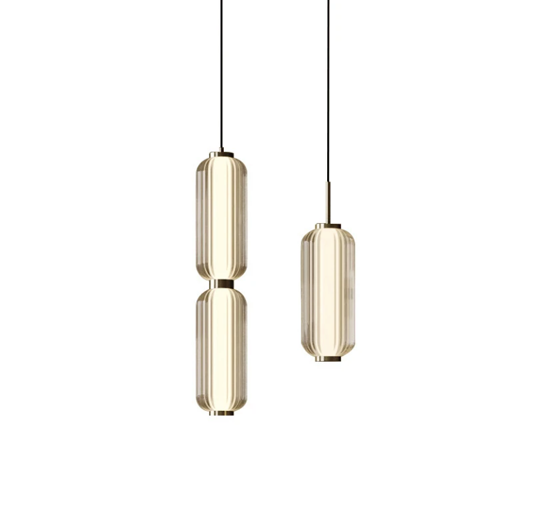 Two gold pendant lights on a white background