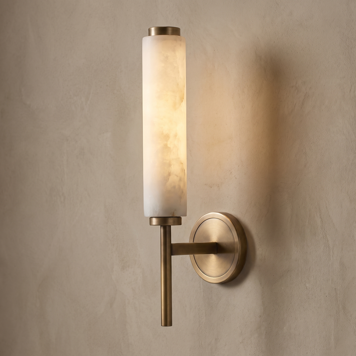 AX290 alabaster wall light glowing warm, tall brass cylinder wall sconce for hallway or living room