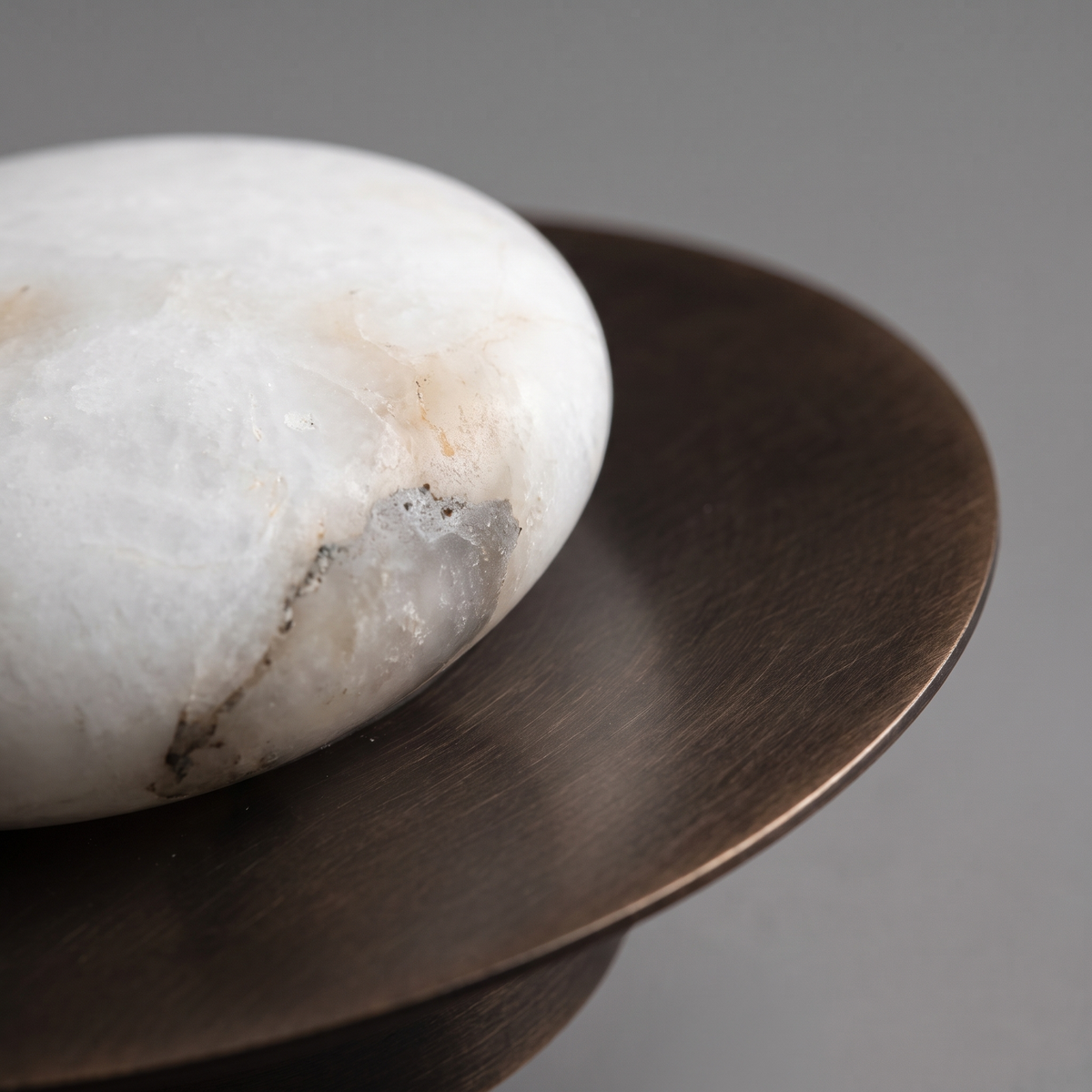 Natural alabaster stone and antique brass detail of the AX174 luxury alabaster sconce